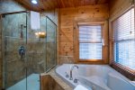 Main Level Master Suite Features Jetted Tub, Stand Up Tile Shower and Double Vanities